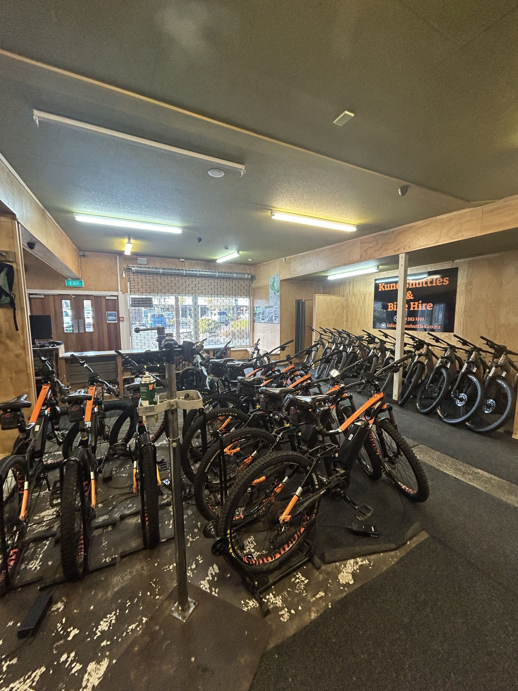 The Kune hire fleet — rows of Norco mountain bikes