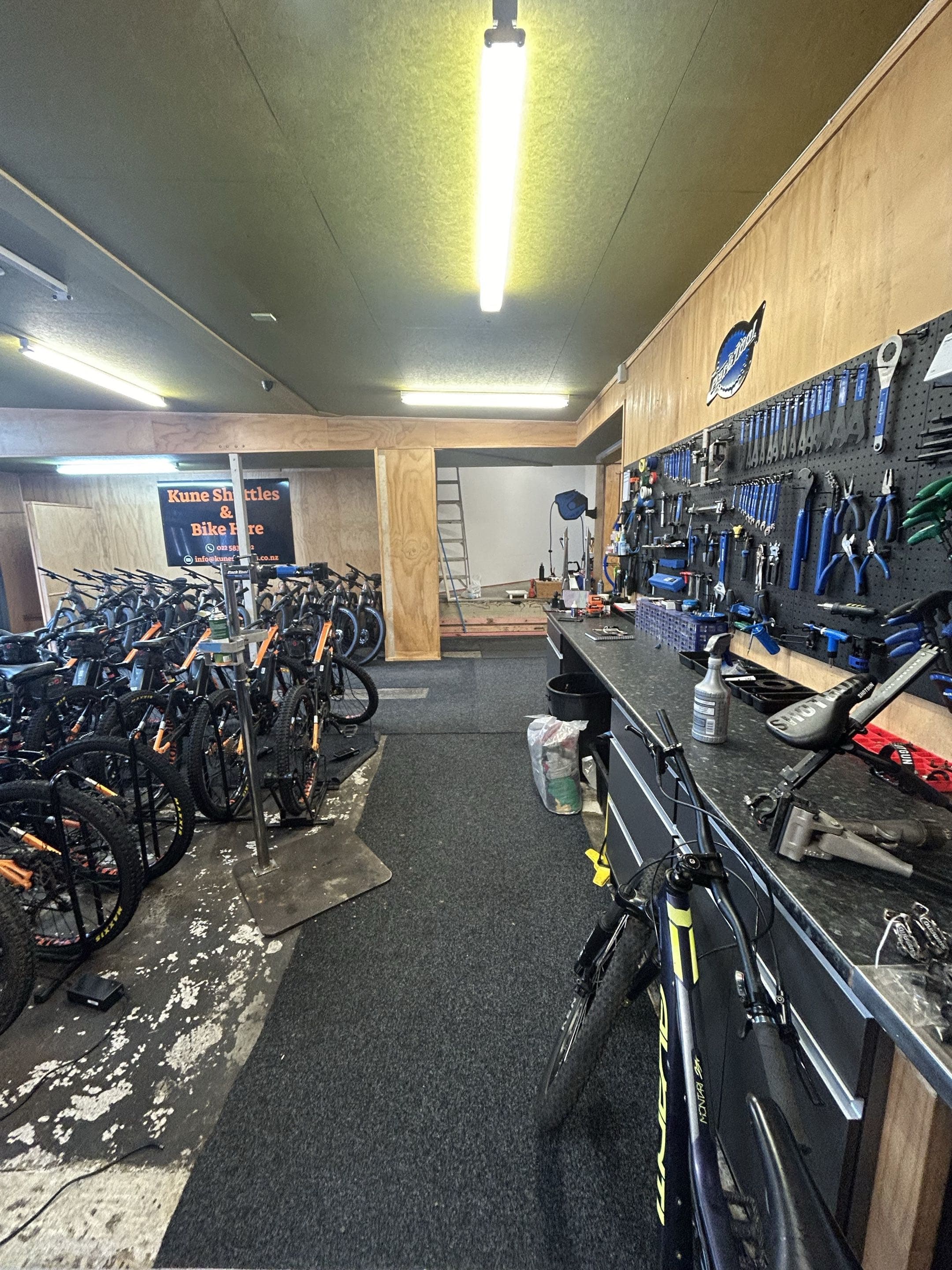 The Kune workshop — Park Tool wall and work stands